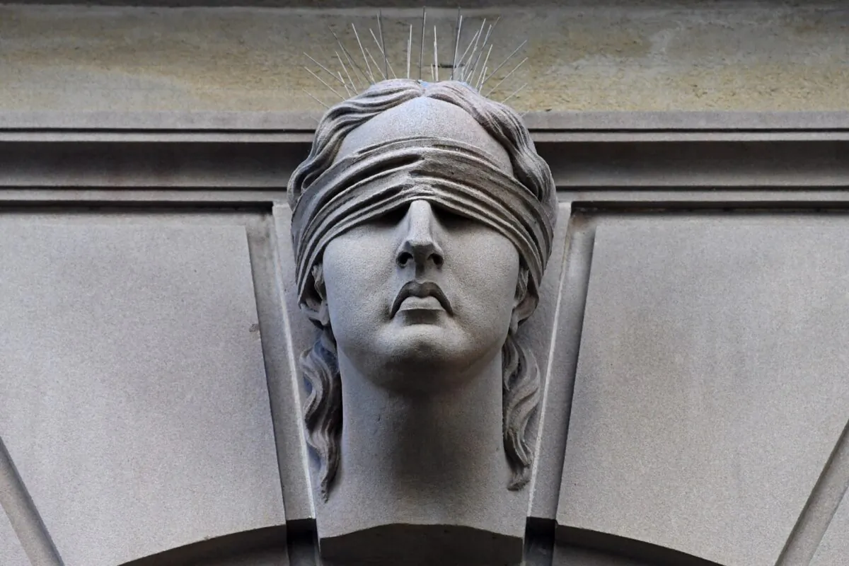 Statue of Lady Justice is seen on Central Local Court  in Sydney, Australia, on July 5, 2017.  (AAP Image/Keri Megelus)