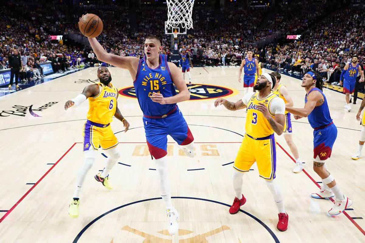 Denver Nuggets center Nikola Jokic (15) pulls down a rebound as Los Angeles Lakers forward Anthony Davis (3) looks on during the first half of Game 1 of the NBA basketball Western Conference Finals series in Denver on May 16, 2023. (Jack Dempsey/AP Photo)