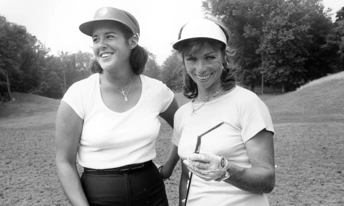 Nancy Lopez (L), stands with one of the LPGA founders, Marlene Hagge, at North Hills Country Club in Manhasset, N.Y., on Aug. 13, 1978. (AP Photo)