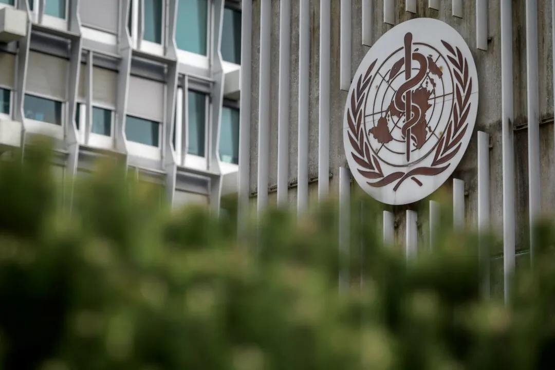 The sign for the World Health Organization (WHO) at its headquarters in Geneva on March 5, 2021. (Fabrice Coffrini/AFP via Getty Images)