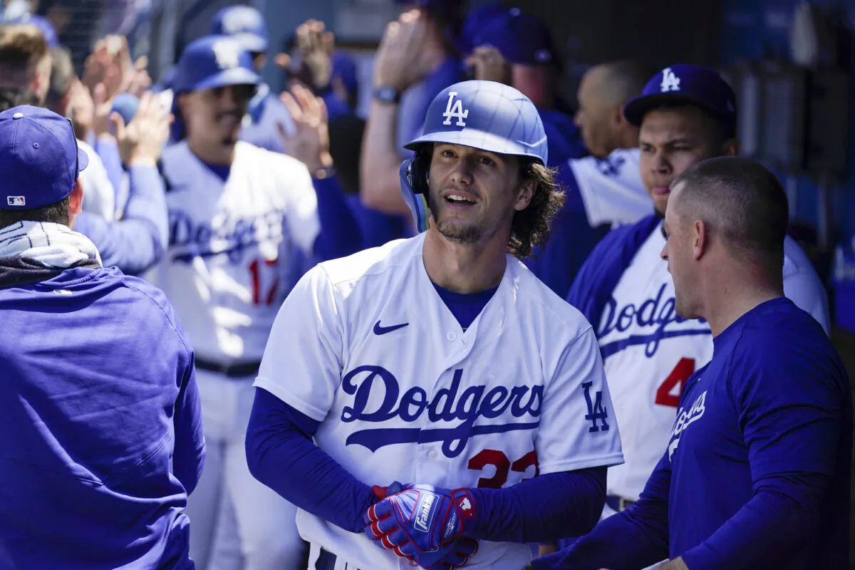 Los Angeles Dodgers' James Outman, center, celebrates in the dugout after hitting a grand slam, scoring Max Muncy, Jason Heyward, and Miguel Vargas, during the seventh inning of a baseball game against the Minnesota Twins in Los Angeles on, May 17, 2023.  (Ashley Landis/AP Photo)