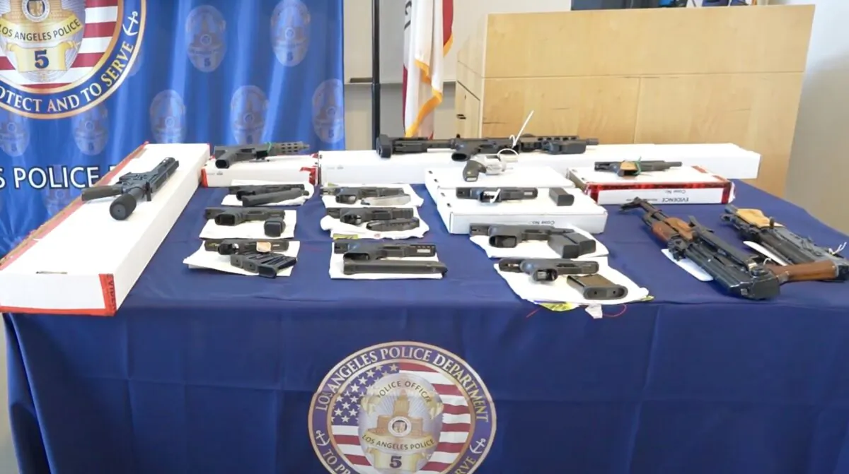 Firearms seized after a dozen suspected members and associates of Los Angeles Harbor-area street gangs were arrested on May 17, 2023. (Adam Lin/NTD Television)