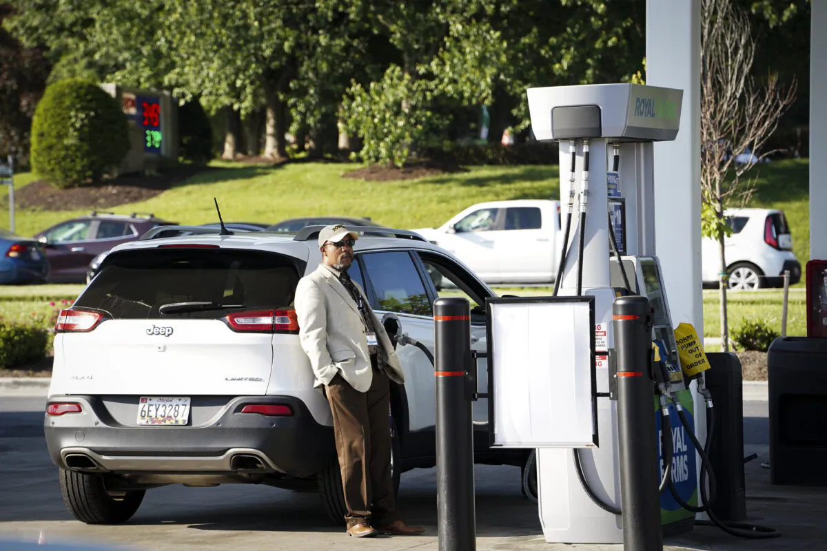 A man uses a gas station in Columbia, Md., on May 17, 2023. (Madalina Vasiliu/The Epoch Times)