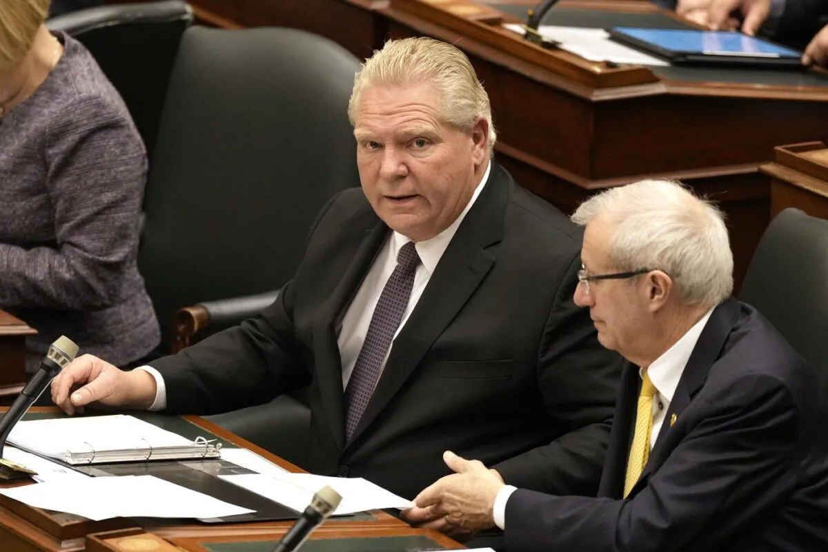 Ontario Premier Doug Ford and Economic Development Minister Vic Fedeli look on as the legislature resumes at Queen's Park in Toronto on Feb. 21, 2023. (The Canadian Press/Frank Gunn)