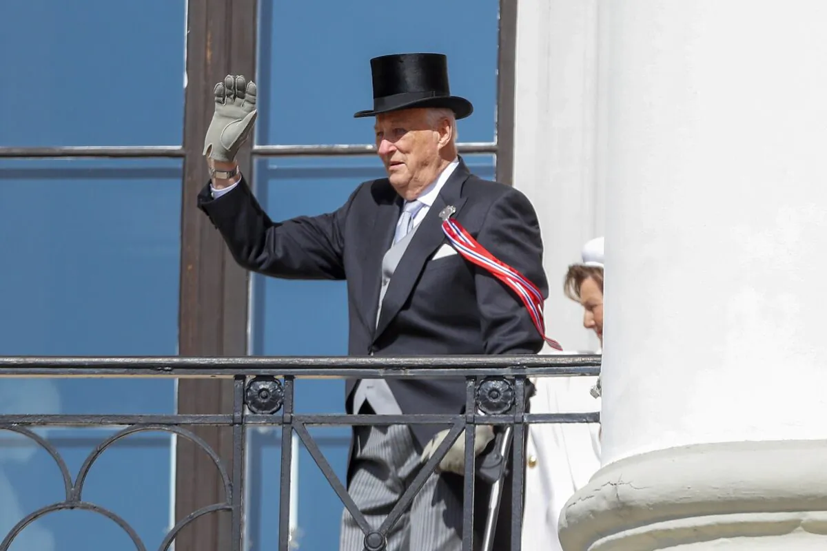 Norway's King Harald V waves from the balcony at Skaugum, their official residence, on the occasion of Norway's Constitution Day, near Oslo, on May 17, 2023. (Frederik Ringnes/NTB Scanpix via AP)