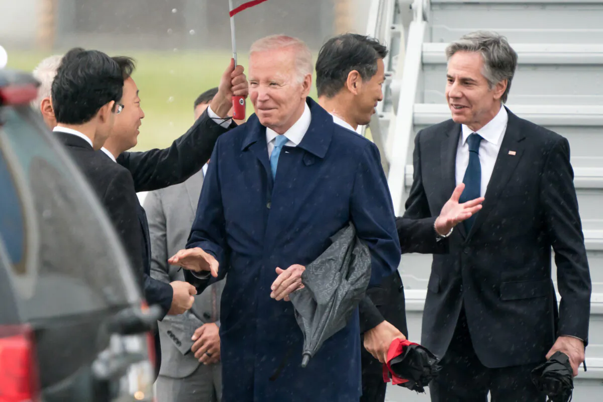 President Joe Biden (C) and U.S. Secretary of State Antony Blinken (R) arrive at Marine Corps Air Station Iwakuni on May 18, 2023, in Iwakuni, Japan. Biden arrived in Japan to attend the G7 summit, which will take place in Hiroshima, Japan. (Tomohiro Ohsumi/Getty Images)
