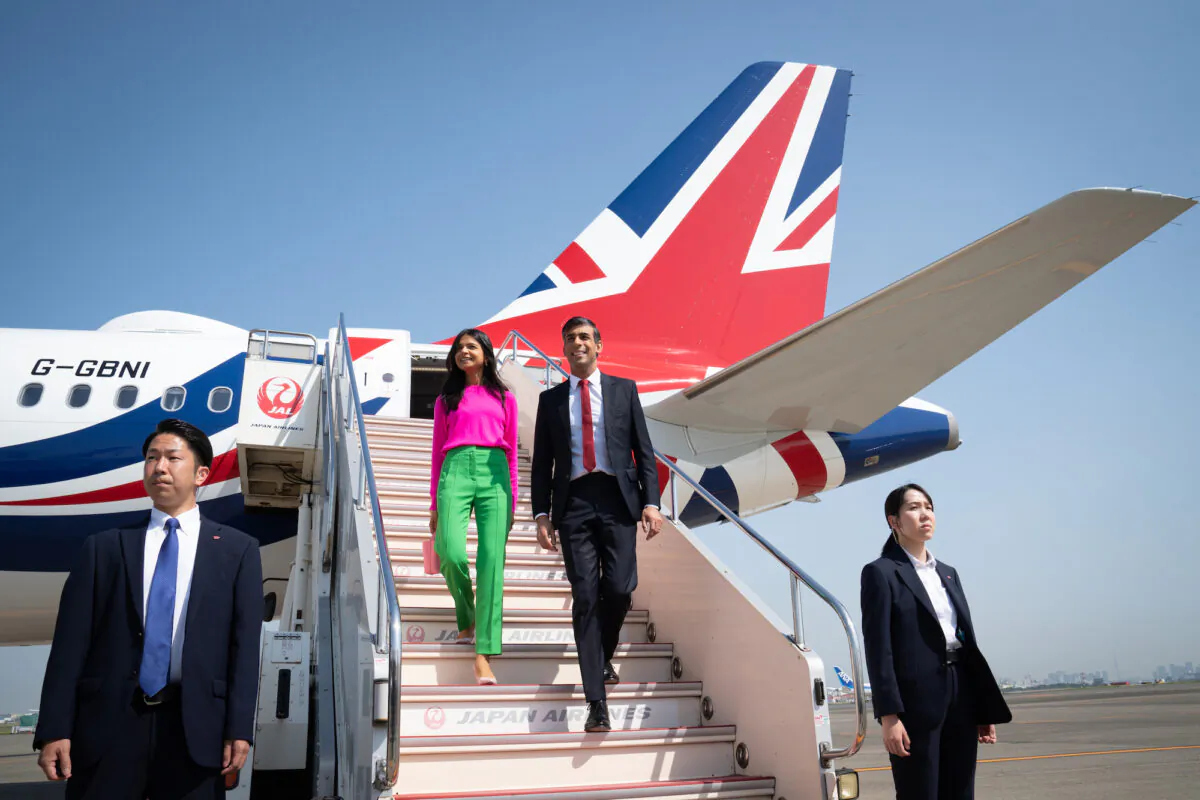 Prime Minister Rishi Sunak and his wife Akshata Murty disembark their plane as they arrive at Tokyo Airport ahead of the G7 Summit in Japan on May 18, 2023. (Stefan Rousseau/PA Wire)