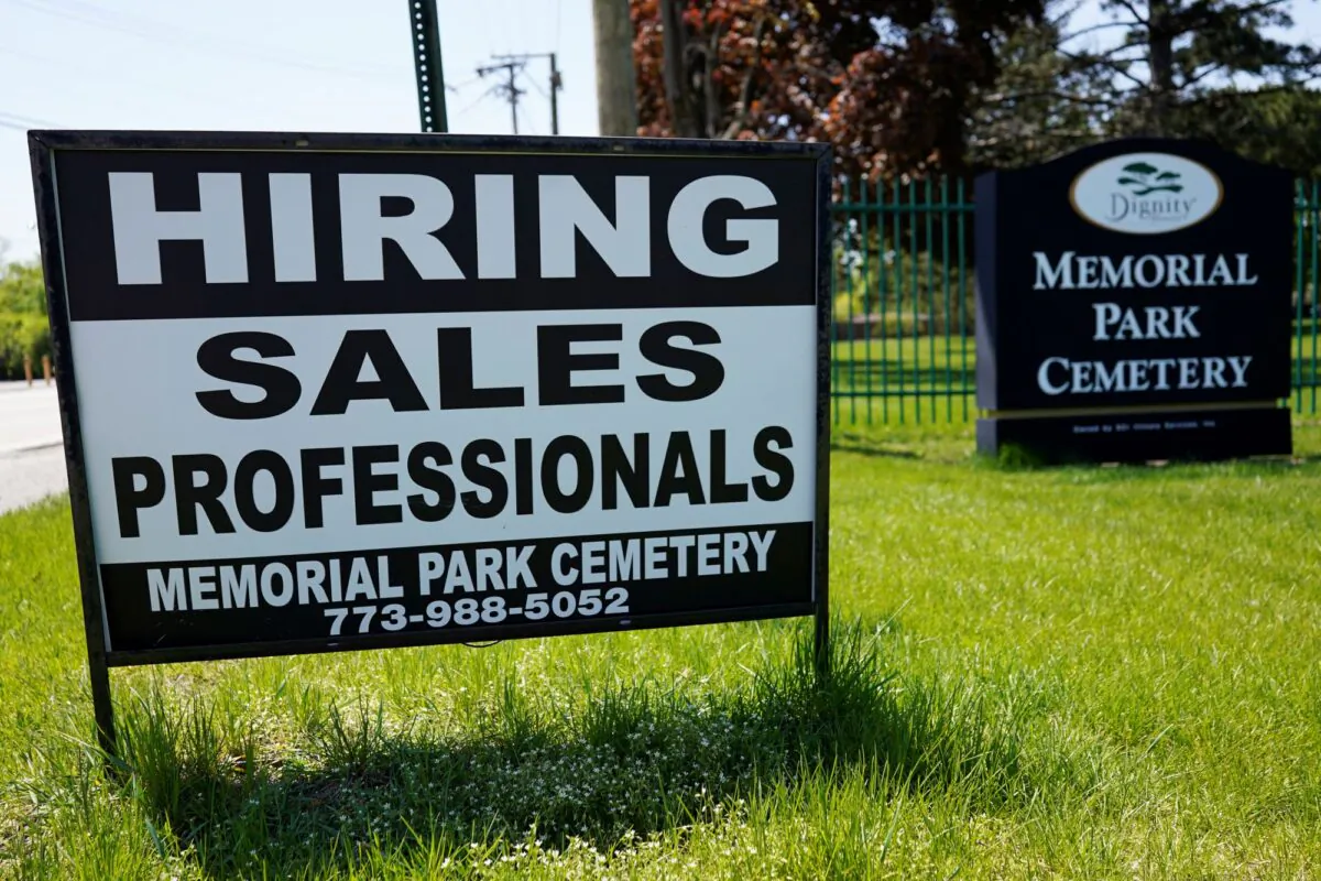 A hiring sign is displayed at a cemetery in Skokie, Ill., on May 10, 2023. (Nam Y. Huh/AP Photo)