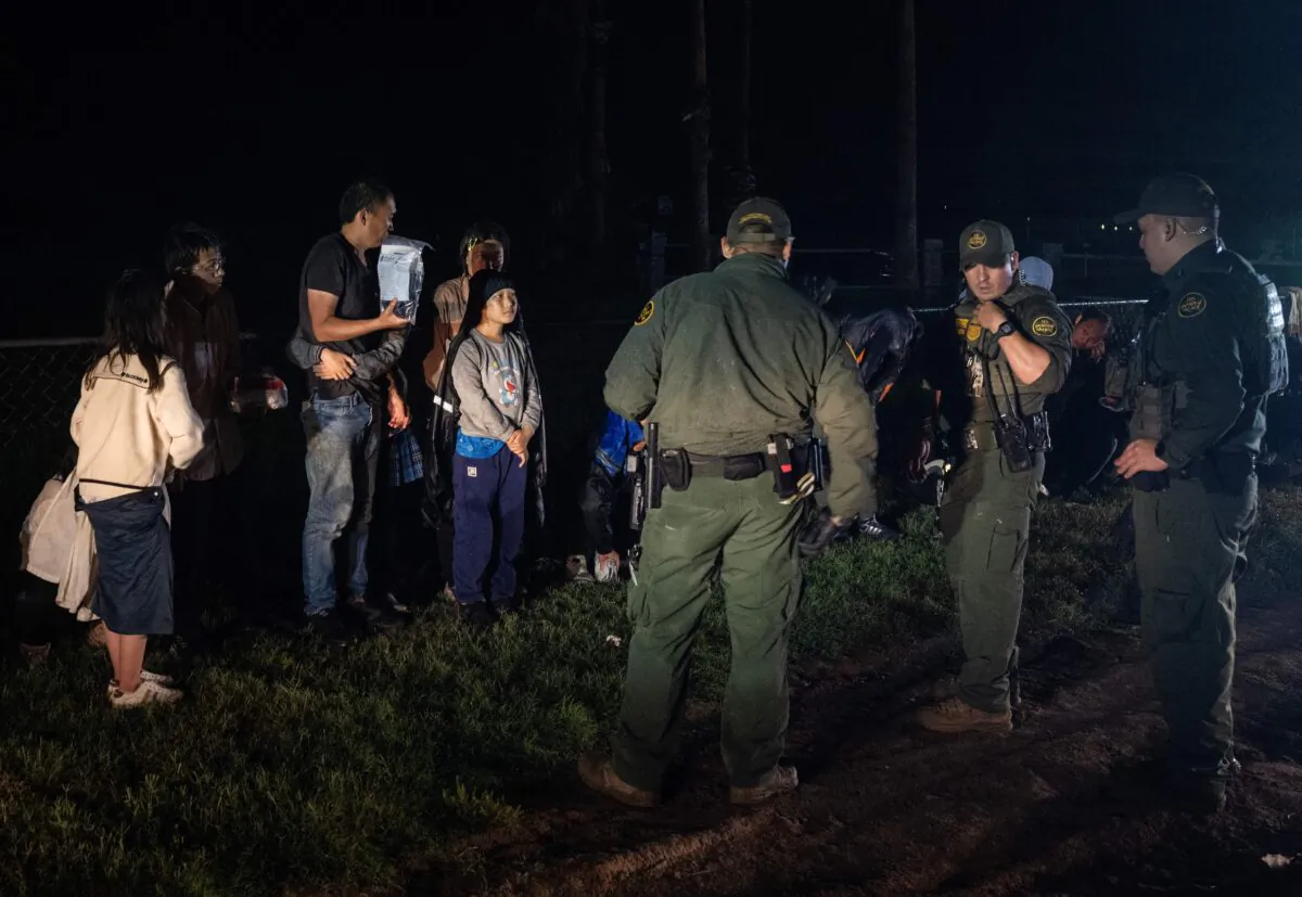 U.S. Border Patrol agents keeps watch over illegal immigrants in Fronton, Texas, on May 12, 2023. (Andrew Caballero-Reynolds/AFP via Getty Images)
