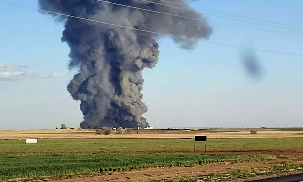 Smoke fills the sky after an explosion and fire at the Southfork Dairy Farms near Dimmitt, Texas, on April 10, 2023. (Castro County Emergency Management via AP)