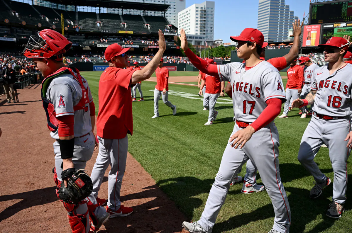 Shohei Ohtani (17) of the Los Angeles Angels celebrates with teammates after a 6–5 victory against the Baltimore Orioles at Oriole Park at Camden Yards in Baltimore on May 18, 2023. (Greg Fiume/Getty Images)