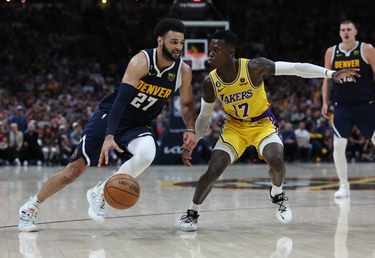 Jamal Murray (27) of the Denver Nuggets drives against Dennis Schroder (17) of the Los Angeles Lakers during the fourth quarter in game two of the Western Conference Finals at Ball Arena in Denver on May 18, 2023. (Matthew Stockman/Getty Images)