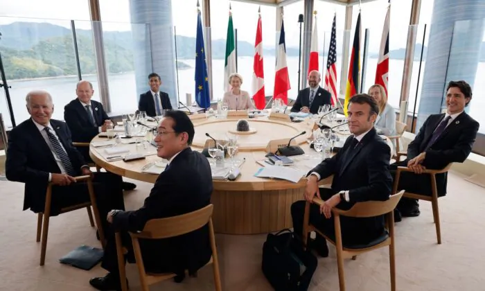(L to R) U.S. President Joe Biden, Germany's Chancellor Olaf Scholz, Britain's Prime Minister Rishi Sunak, Japan's Prime Minister Fumio Kishida, European Commission President Ursula von der Leyen, European Council President Charles Michel, France's President Emmanuel Macron, Italy's Prime Minister Giorgia Meloni, and Canada's Prime Minister Justin Trudeau take part in a working lunch session as part of the G7 Leaders' Summit in Hiroshima on May 19, 2023. (Ludovic Marin/AFP via Getty Images)