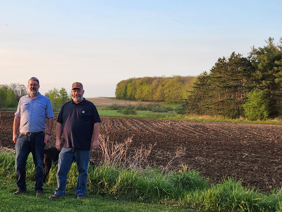 Marti Machtan and Tom Wilcox at a farm free of wind turbines in Wisconsin in 2023. (Courtesy of Tom Wilcox)