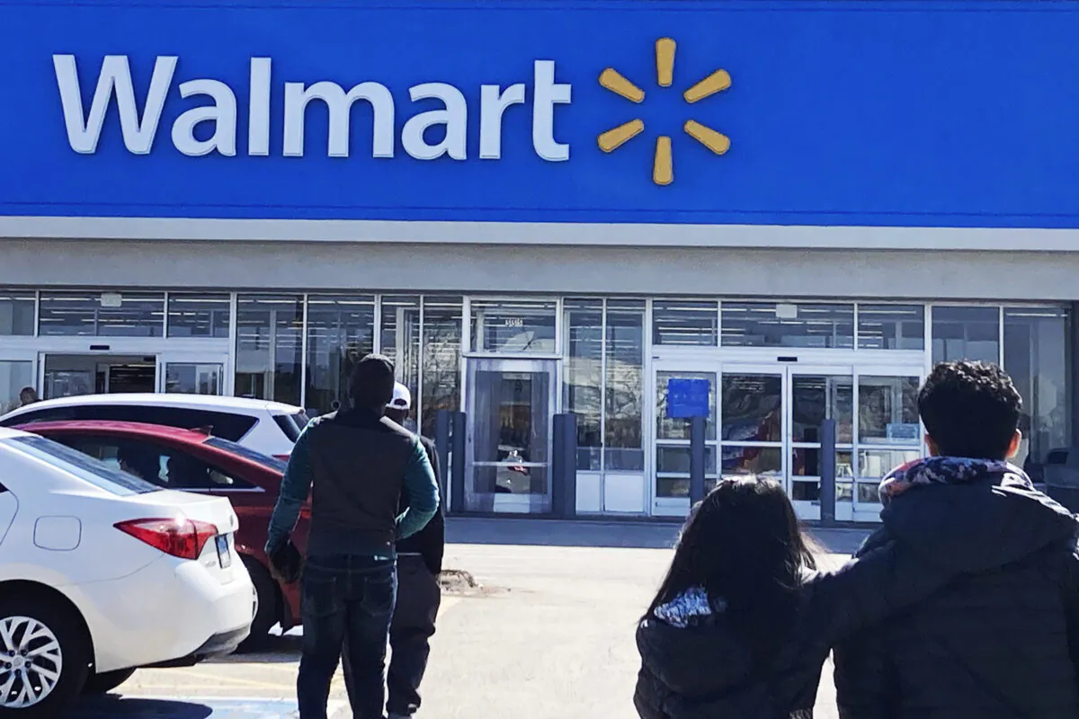 Shoppers walk to a Walmart in Vernon Hills, Ill., March 28, 2023. (Nam Y. Huh/AP Photo)