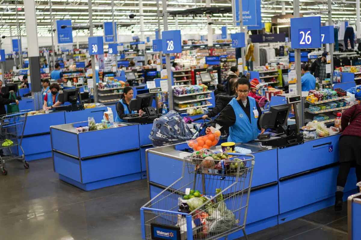 Cashiers process purchases at a Walmart Supercenter in North Bergen, N.J., on Feb. 9, 2023. (Eduardo Munoz Alvarez/AP Photo/File)