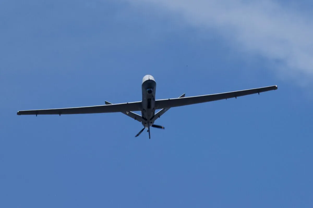 A General Atomics MQ-9 Reaper remotely piloted aircraft (RPA) performs a fly-over during the Bastille Day military parade on the Champs-Élysées in Paris, France, on July 14, 2022. (Ludovic Marin/AFP via Getty Images)