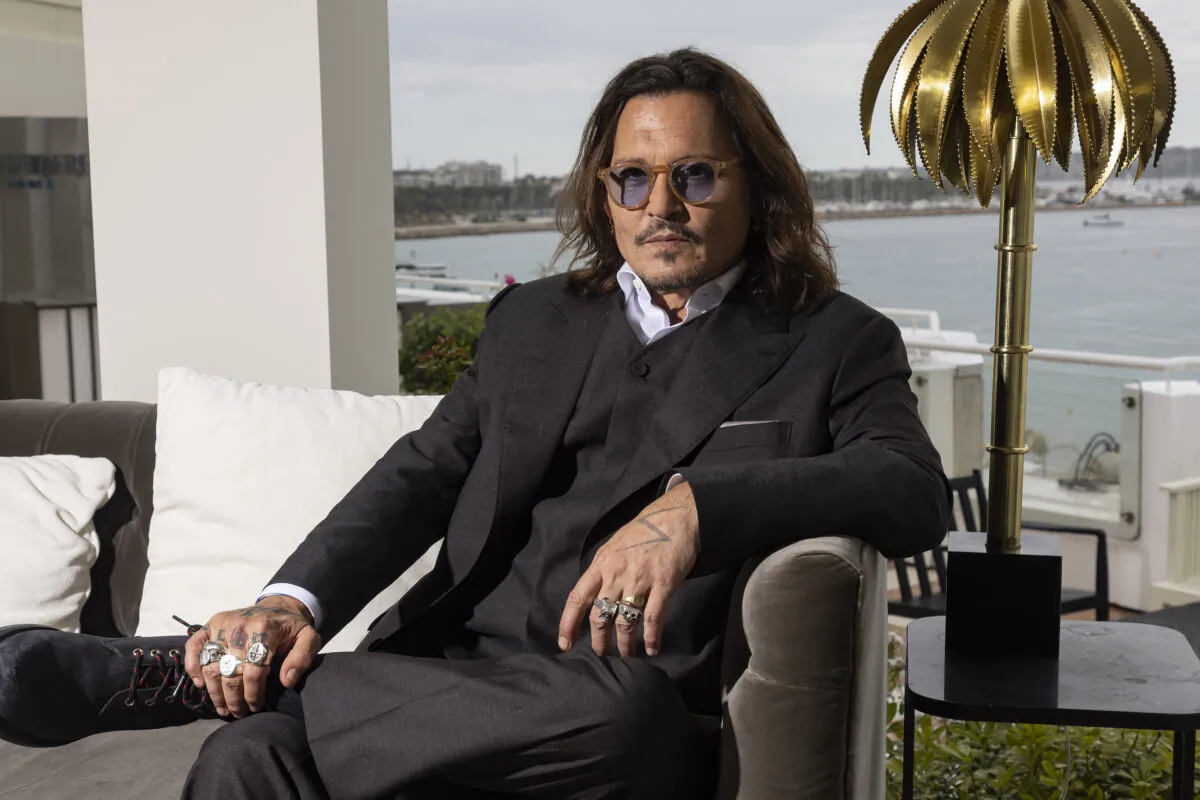 Johnny Depp poses for portrait photographs for the film 'Jeanne du Barry' at the 76th international film festival in Cannes, southern France, on May 17, 2023. (Joel C Ryan/Invision/AP)