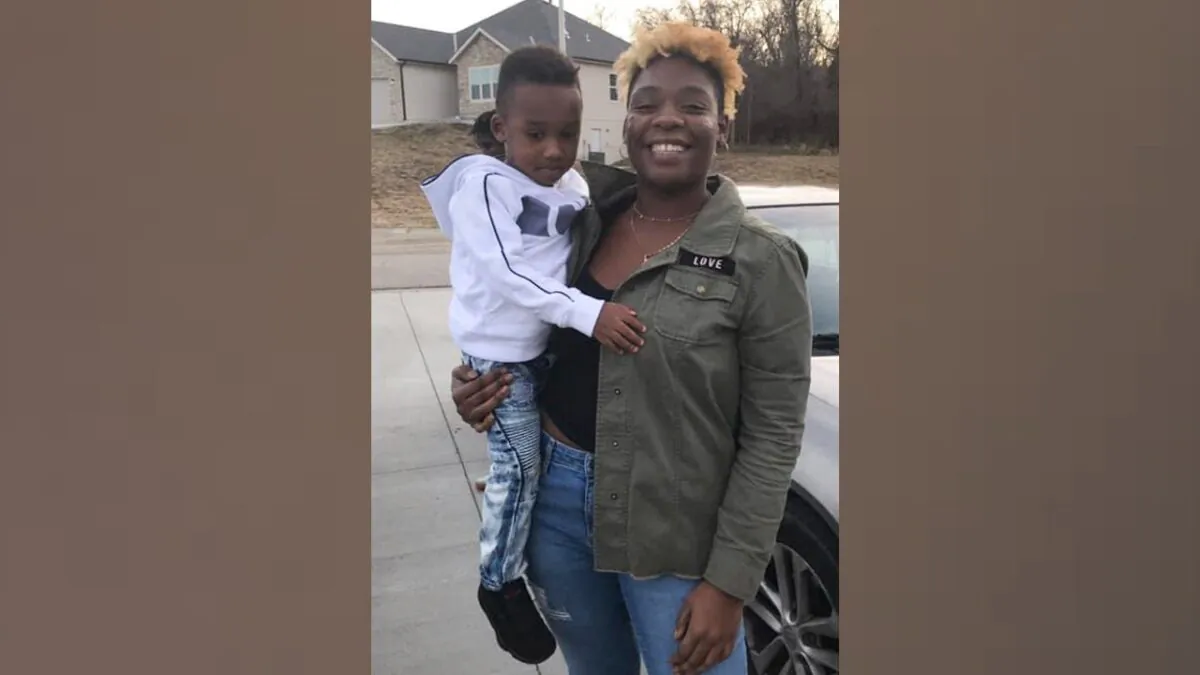 Sir’Antonio Brown (L) is held in the arms of his mother, Shayna Davis, in 2019. (Courtesy of Shyneisha Hill via AP)