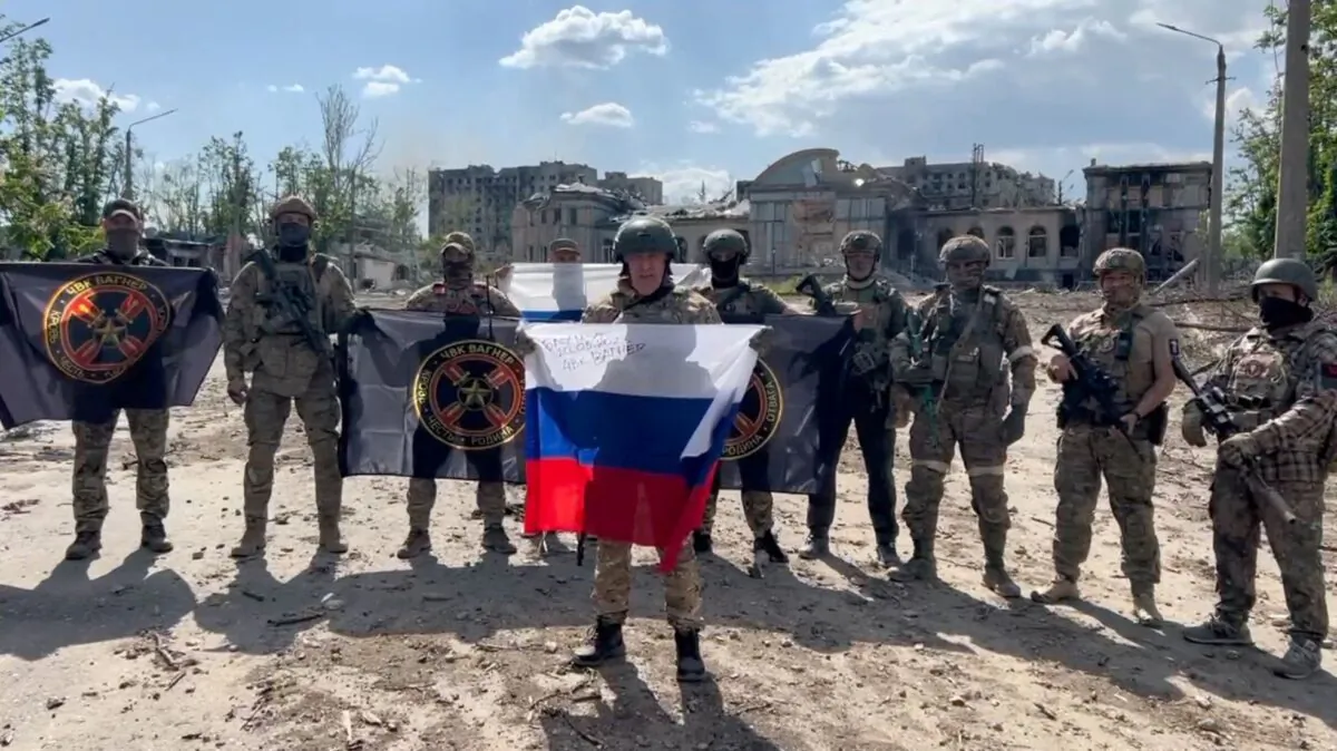 Yevgeny Prigozhin makes a statement as he stand next to Wagner fighters in the course of Russia-Ukraine conflict in Bakhmut, Ukraine, in this still image taken from video released on May 20, 2023. (Press service of "Concord"/Handout via Reuters)