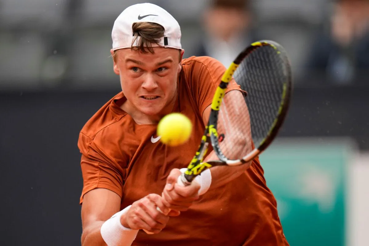 Denmark's Holger Rune returns the ball during a semi final match against Norway's Casper Ruud at the Italian Open tennis tournament in Rome, Italy, on May 20, 2023. (Alessandra Tarantino/AP)