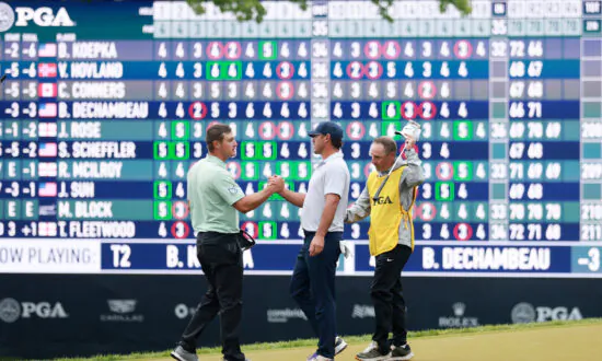 Brooks Koepka Powers Ahead at Waterlogged PGA Championship
