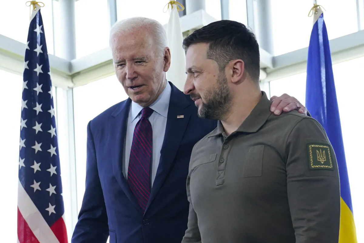 U.S. President Joe Biden (L) walks with Ukrainian President Volodymyr Zelenskyy ahead of a working session on Ukraine during the G-7 Leaders' Summit in Hiroshima, Japan, on May 21, 2023. (Susan Walsh/Pool/AFP via Getty Images)