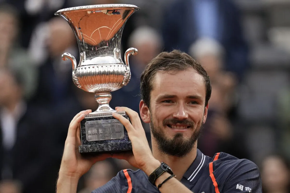 Daniil Medvedev of Russia lifts the trophy after defeating Denmark's Holger Rune during the men's final tennis match at the Italian Open tennis tournament in Rome on May 21, 2023. (Alessandra Tarantino/AP Photo)