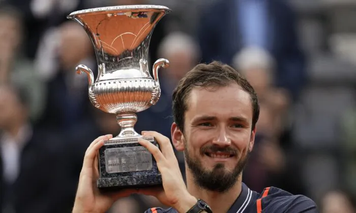 Daniil Medvedev of Russia lifts the trophy after defeating Denmark's Holger Rune during the men's final tennis match at the Italian Open tennis tournament in Rome on May 21, 2023. (Alessandra Tarantino/AP Photo)
