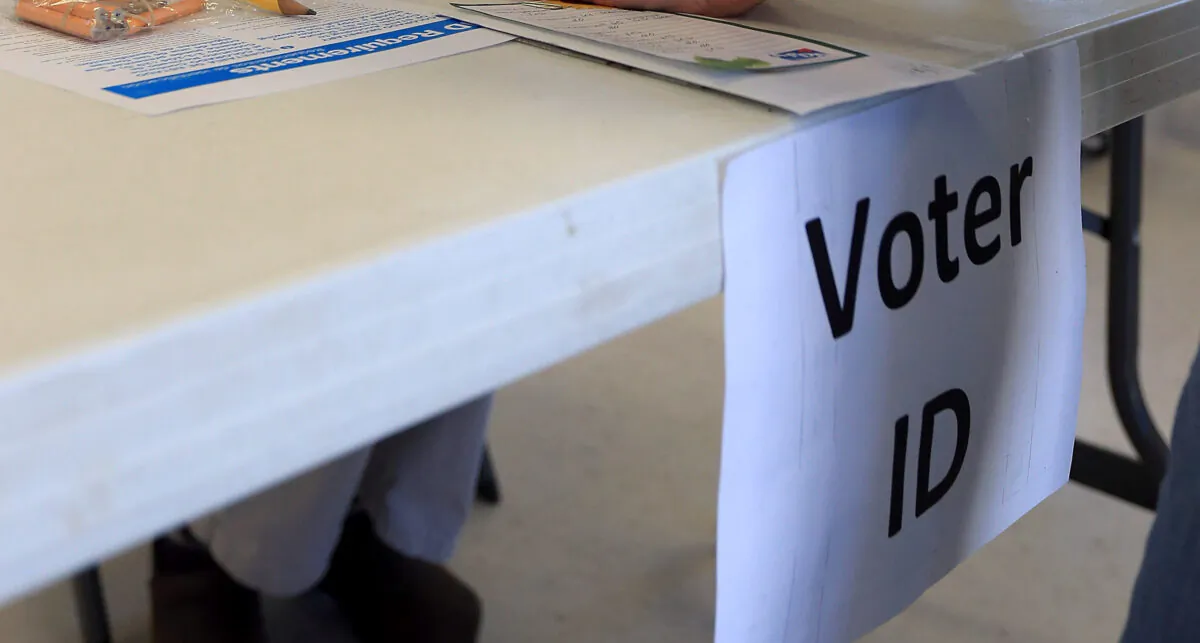 A "Voter ID" sign at a polling site in a file photo. (Jeff Swensen/Getty Images)