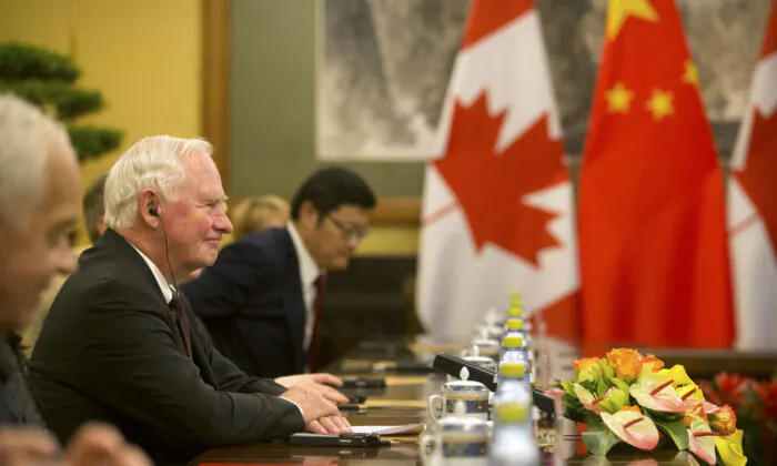 Then-Governor General of Canada David Johnston (L) meets with Chinese leader Xi Jinping (not shown) at the Diaoyutai State Guesthouse in Beijing, China, on July 13, 2017. (Mark Schiefelbein/Pool/Getty Images)