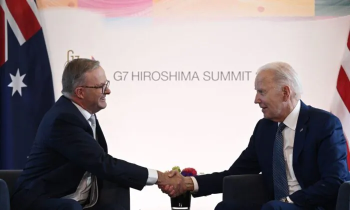 U.S. President Joe Biden (R) shakes hands with Australia's Prime Minister Anthony Albanese during a bilateral meeting as part of the G-7 Leaders' Summit in Hiroshima on May 20, 2023. (Photo by BRENDAN SMIALOWSKI/AFP via Getty Images)