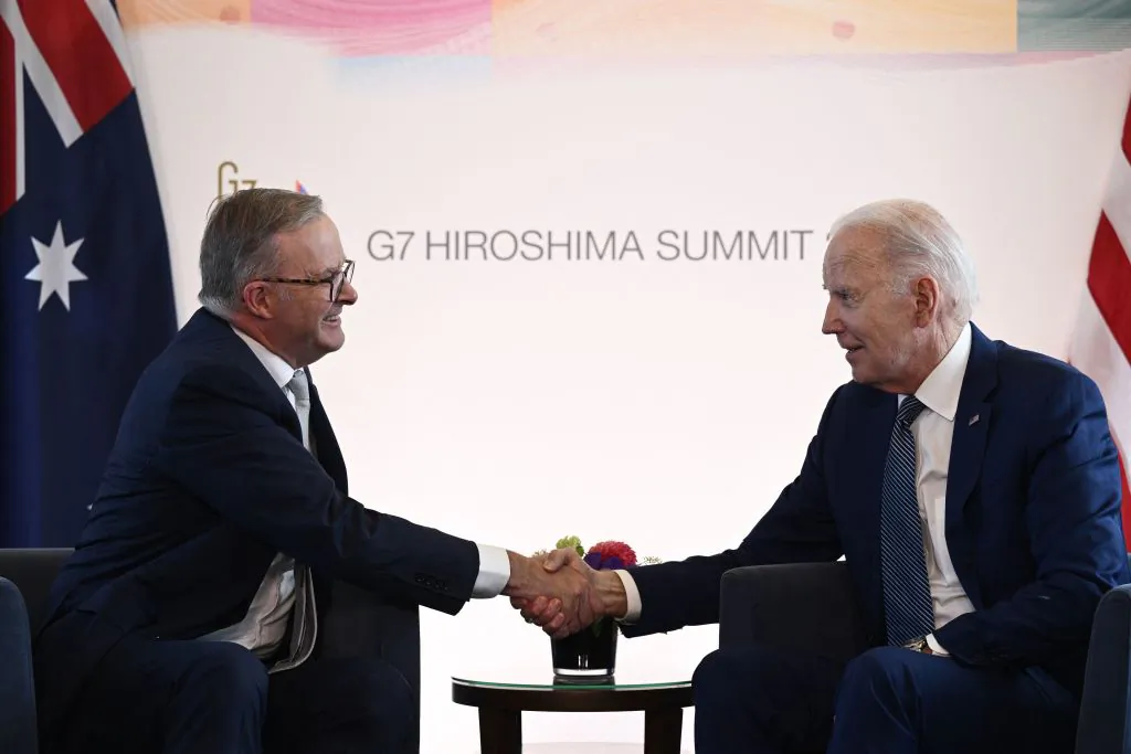 U.S. President Joe Biden (R) shakes hands with Australia's Prime Minister Anthony Albanese during a bilateral meeting as part of the G-7 Leaders' Summit in Hiroshima on May 20, 2023. (Photo by BRENDAN SMIALOWSKI/AFP via Getty Images)