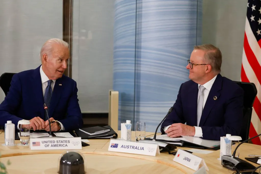 US President Joe Biden (L) and Australia's Prime Minister Anthony Albanese attend a quad meeting with Japan's Prime Minister Fumio Kishida (not pictured) and India's Prime Minister Narendra Modi (not pictured) on the sidelines of the G7 Leaders' Summit in Hiroshima on May 20, 2023. (Photo by JONATHAN ERNST / POOL / AFP) (Photo by JONATHAN ERNST/POOL/AFP via Getty Images)