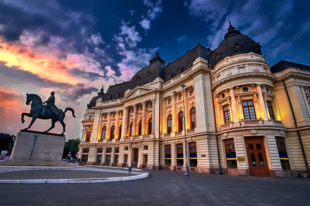 The action in "The Bucharest Legacy" takes places in Bucharest, Romania. Scene at sunset at the Bucharest Library. (Razvan Dragomirescu/Shutterstock)