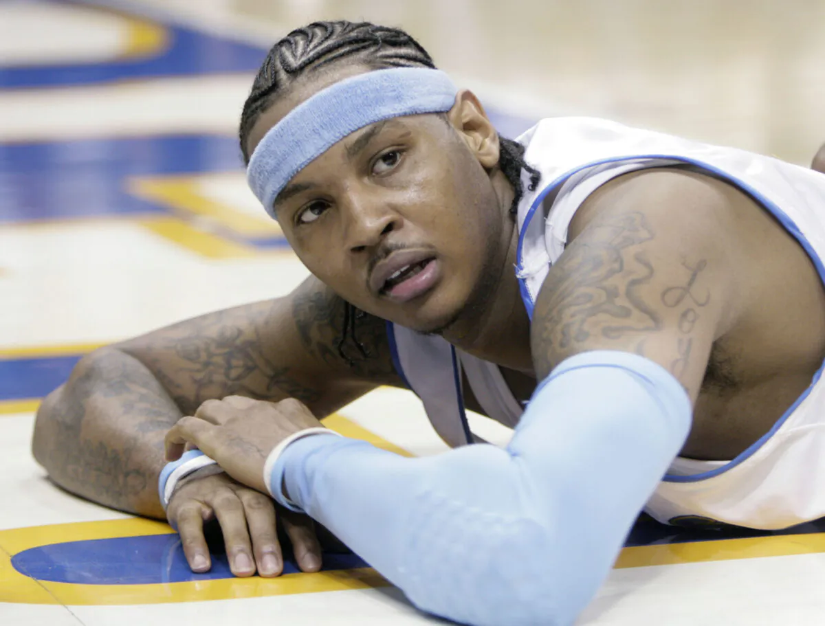 Denver Nuggets forward Carmelo Anthony looks up from the floor after getting called for a foul in the fourth quarter of game 3 of the NBA Western Conference playoff series against the San Antonio Spurs in Denver on April 28, 2007. (David Zalubowski/AP Photo)