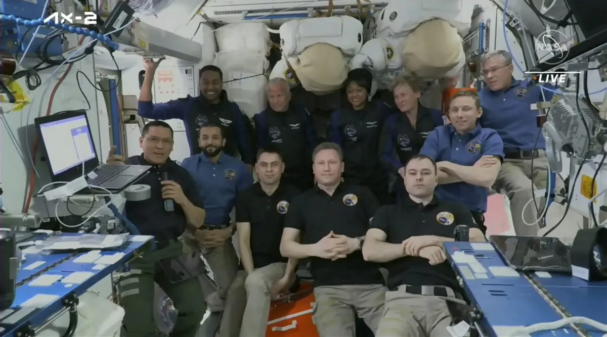 (Top row L–R) Ali al-Qarni, John Shoffner, Rayyanah Barnawi, and Peggy Whitson, pose for a picture with current residents of the International Space Station on May 22, 2023. (NASA TV via AP)