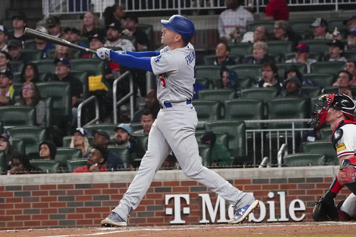 Los Angeles Dodgers' Freddie Freeman (5) hits a three-run home run as Atlanta Braves catcher Sean Murphy, right, looks on in the fifth inning of a baseball game in Atlanta on May 22, 2023. (AP Photo/John Bazemore)