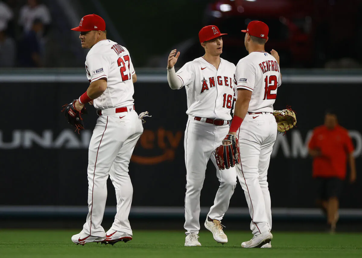 Mickey Moniak (16), Mike Trout (27) and Hunter Renfroe (12) of the Los Angeles Angels celebrate a win against the Boston Red Sox at Angel Stadium of Anaheim in Anaheim, Calif., on May 22, 2023. (Ronald Martinez/Getty Images)