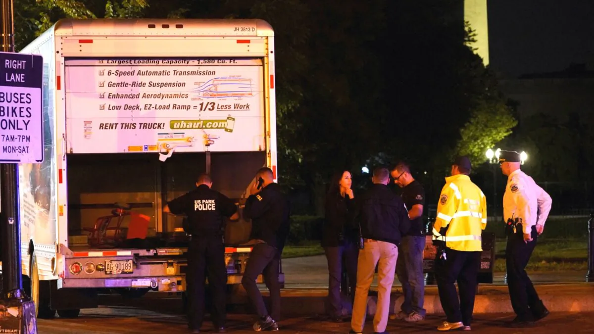 The U.S. Secret Service and other law enforcement agencies investigate a rented box truck that crashed into security barriers at Lafayette Park across from the White House in Washington on May 23, 2023. (Nathan Howard/Reuters)