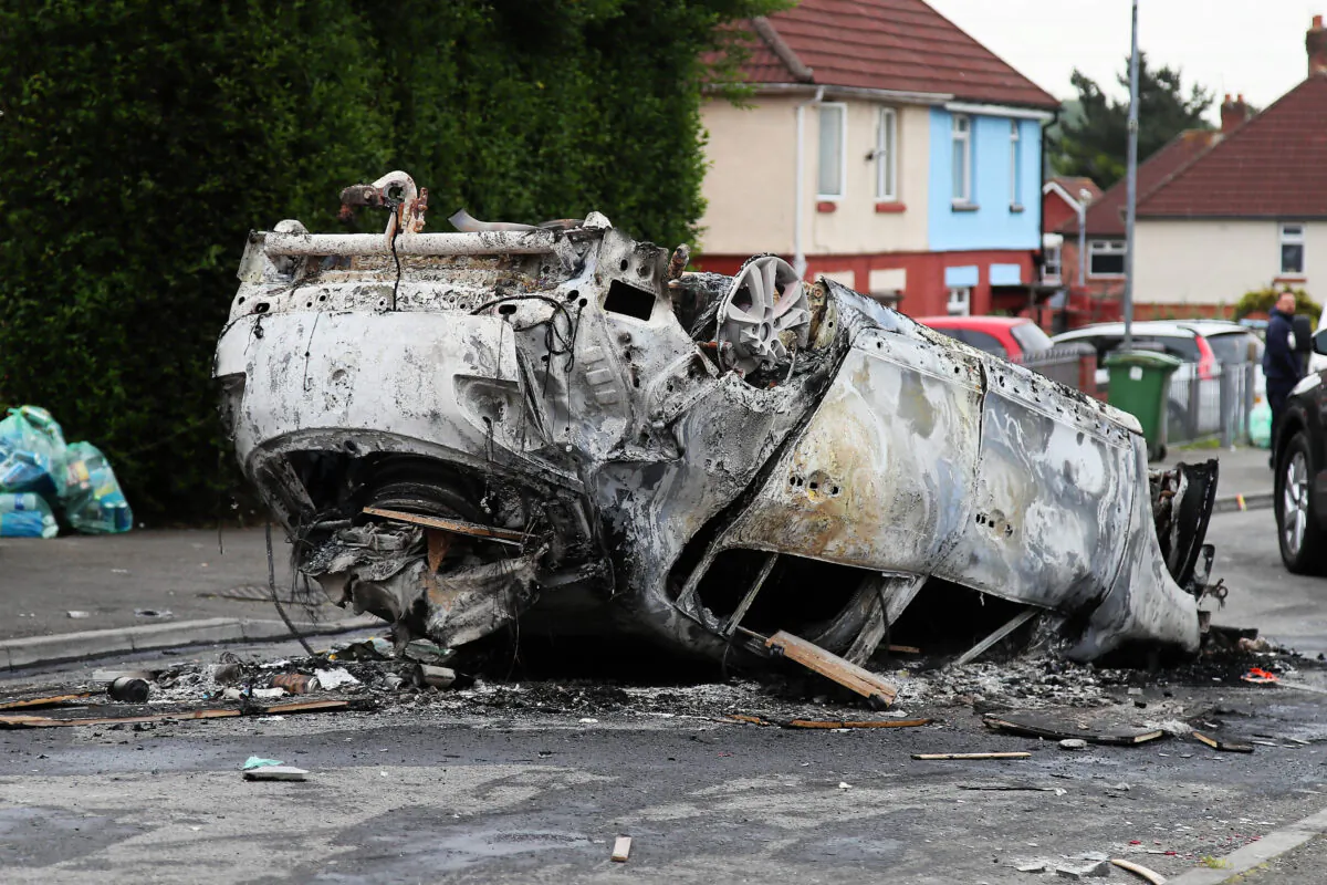 A car that was set alight following the riot in Ely, Cardiff, Wales, on May 23, 2023. (PA Media)