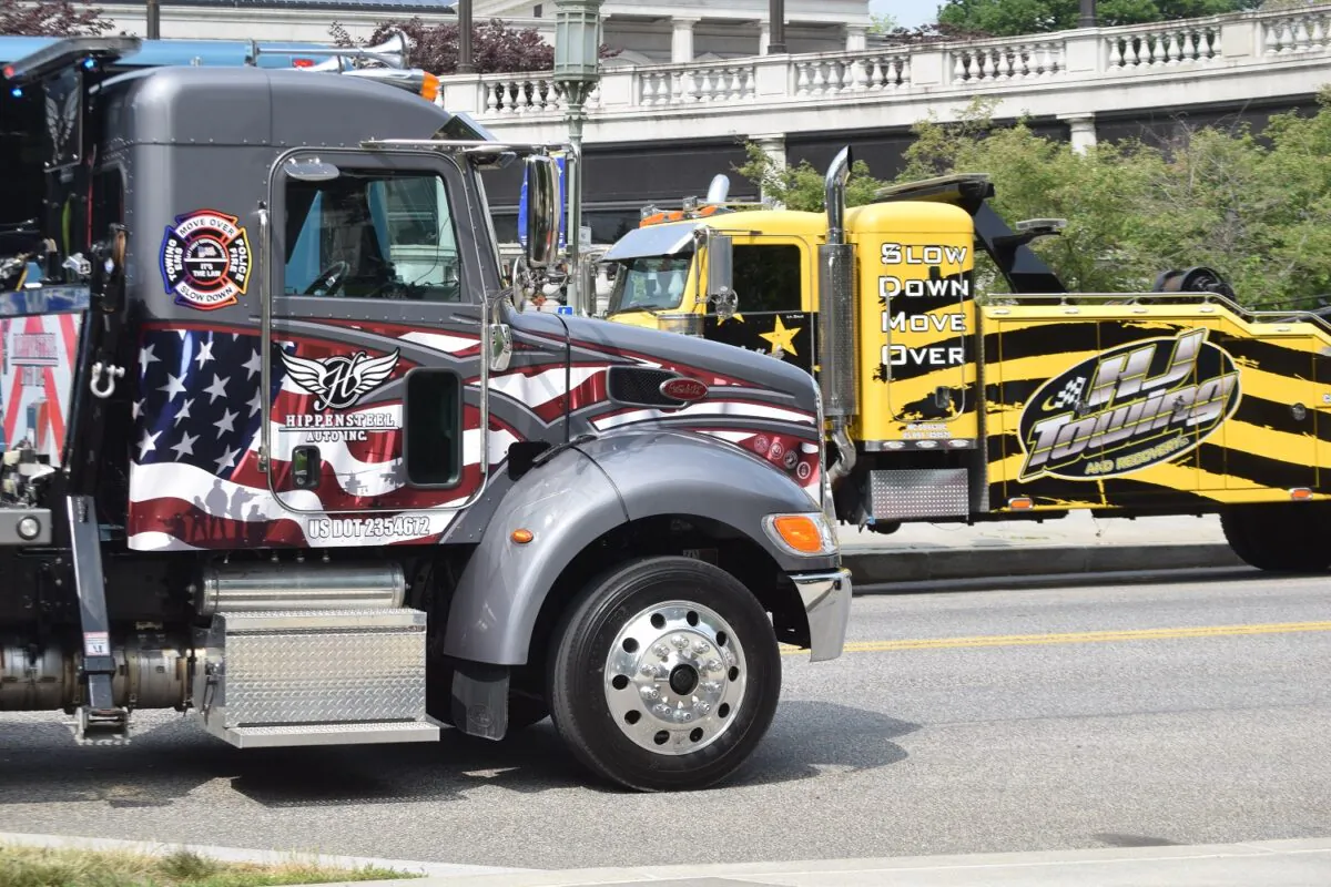 Pennsylvania tow truck operators gathered in front of the state Capitol building in Harrisburg to bring awareness to roadside safety on May 22, 2023. (Beth Brelje/The Epoch Times) 
