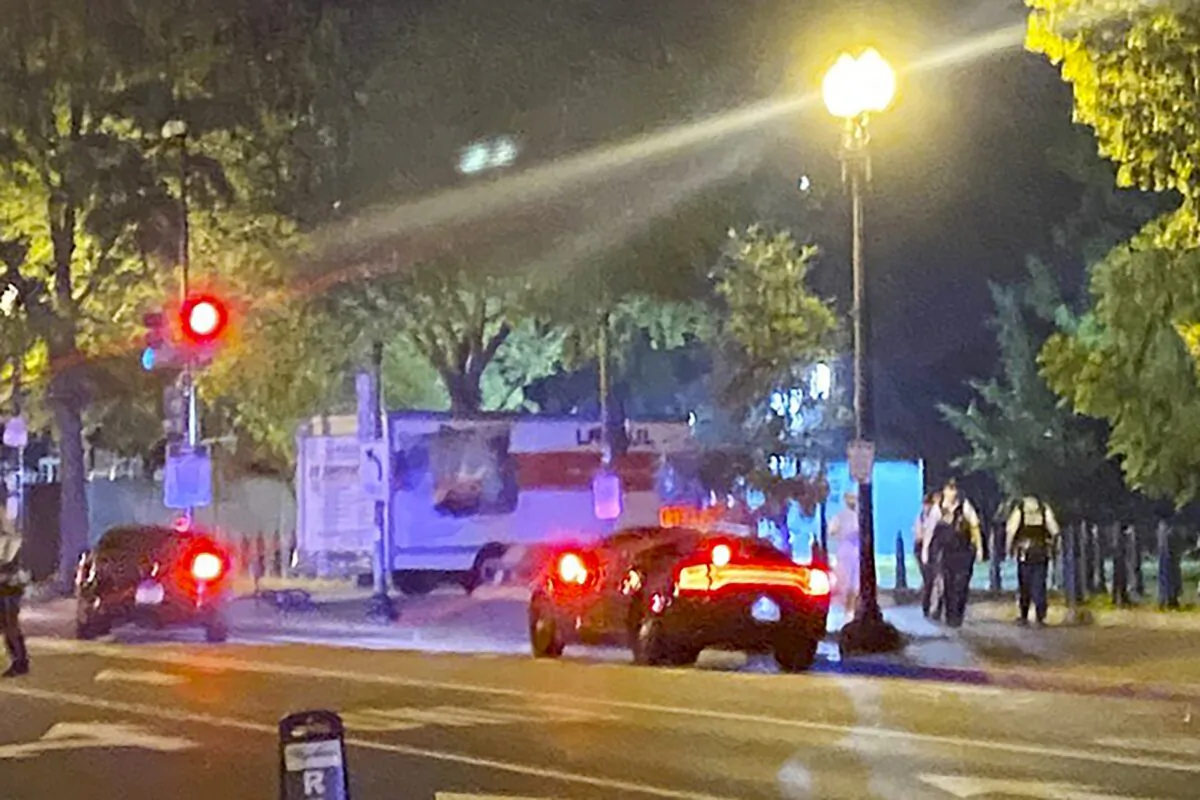A box truck is seen crashed into a security barrier at a park across from the White House on May 22, 2023. (Benjamin Berger via AP)