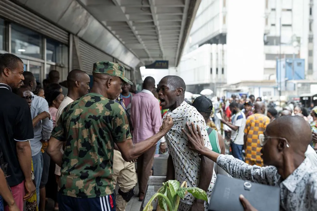 People argue while in line outside a bank in Lagos, Nigeria, on Feb. 22, 2023, ahead of the presidential election scheduled for Feb. 25, 2023. (Patrick Meinhardt/AFP via Getty Images)