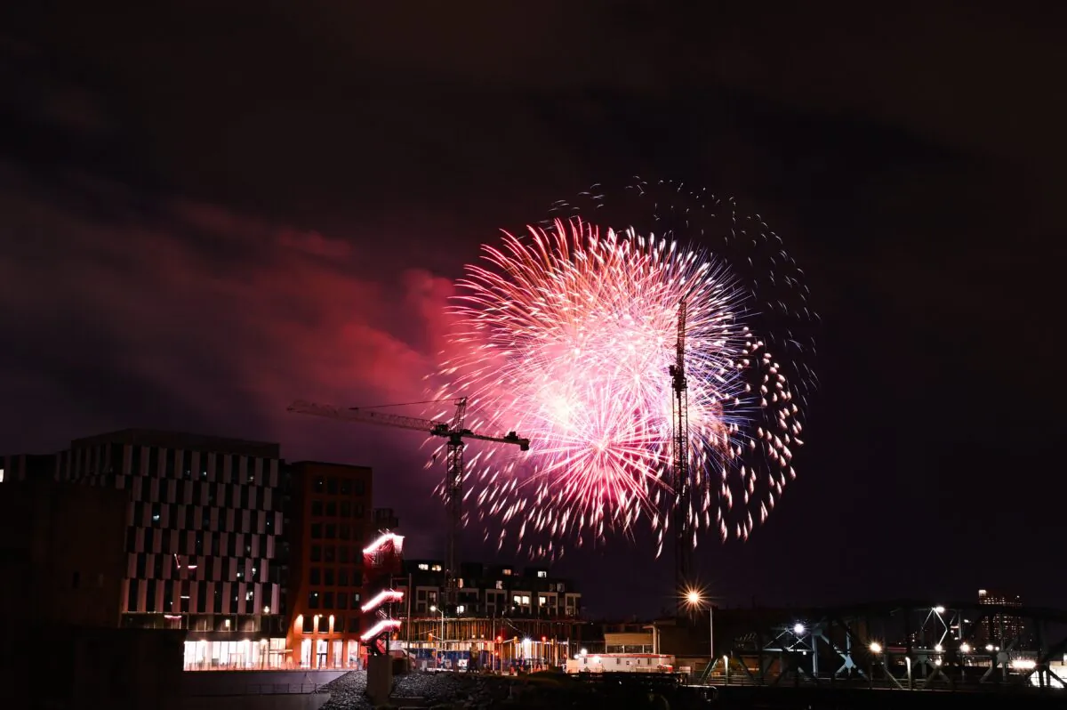 Fireworks explode over the Ottawa River as seen from Gatineau, Que., during Canada Day celebrations on July 1, 2022. (The Canadian Press/Spencer Colby)