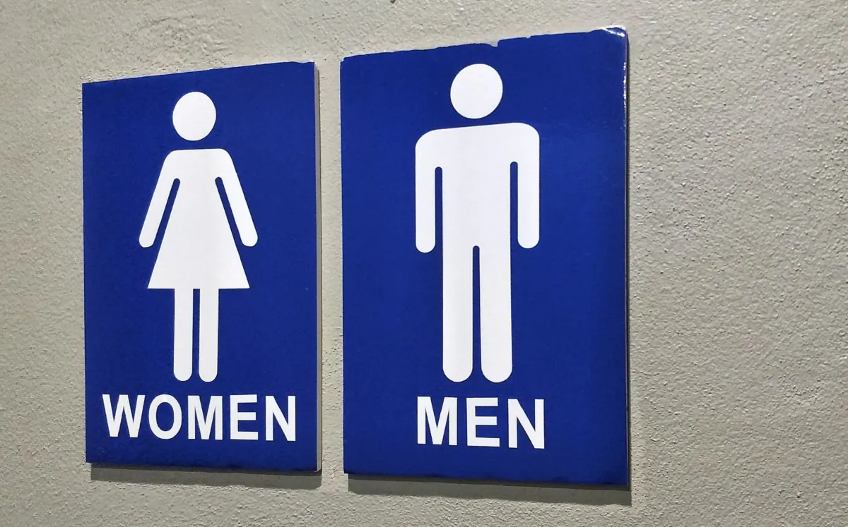 A sign of segregated male and female restrooms. (thitiwat_t1980/Shutterstock)