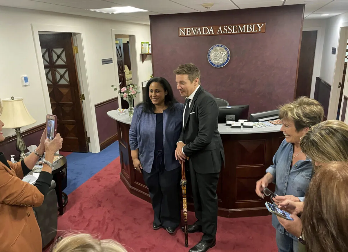 Actor Jeremy Renner (R) poses for a photo with Democratic Assemblywoman Brittney Miller in Carson City, Nev., on May 22, 2023. (Gabe Stern/AP Photo)