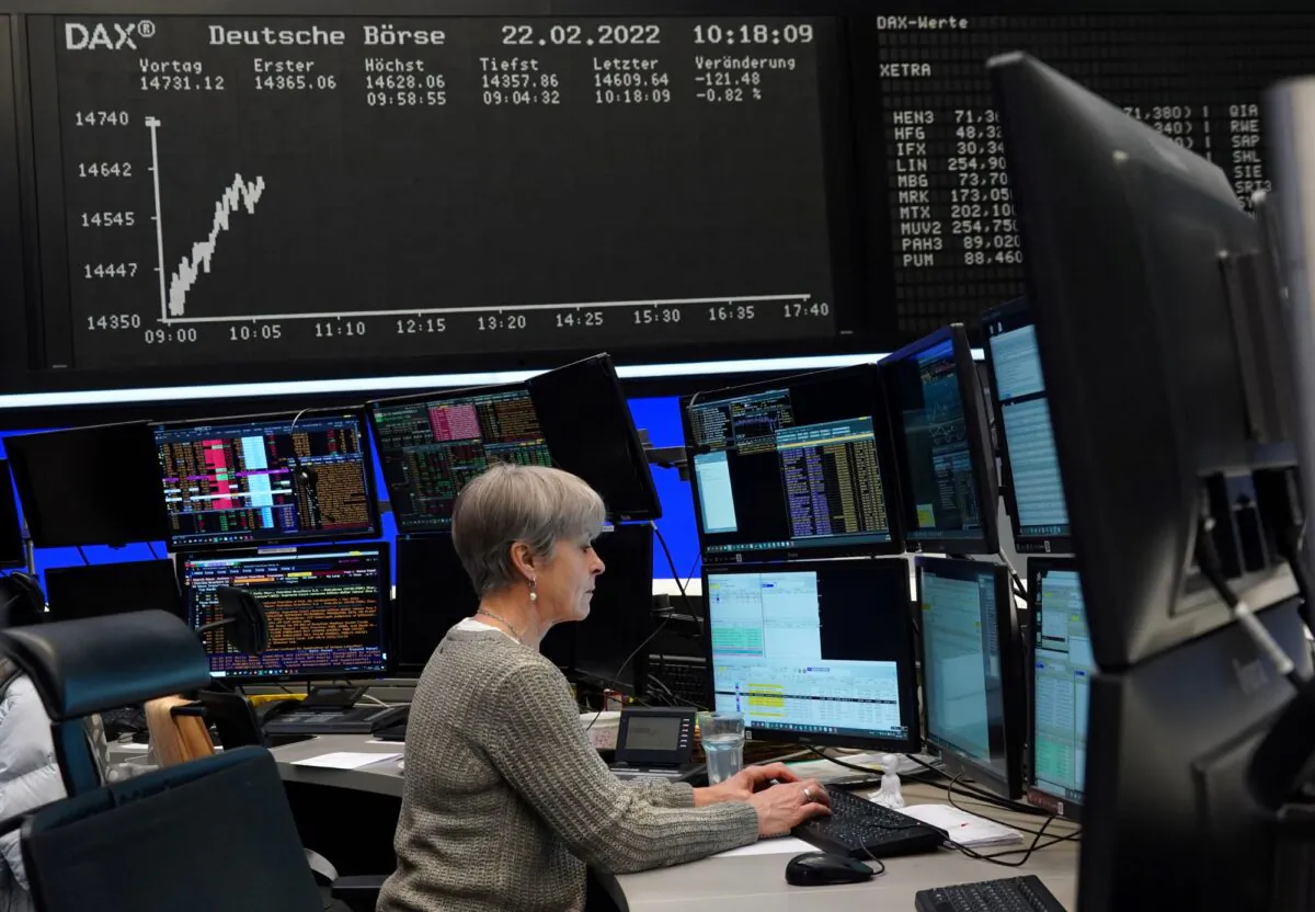 A trader works at the Frankfurt stock exchange in Frankfurt, Germany, on Feb. 22, 2022. (Timm Reichert/Reuters)