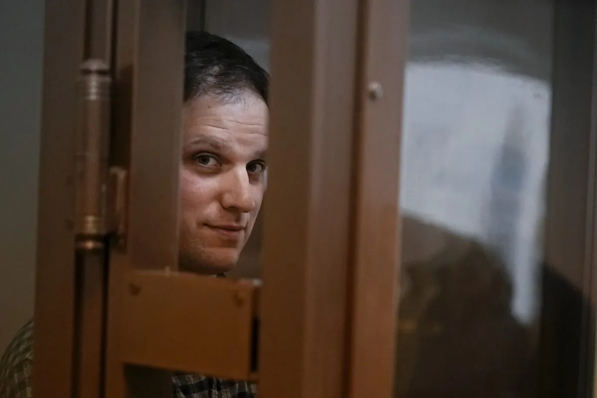 Wall Street Journal reporter Evan Gershkovich stands in a glass cage in a courtroom at the Moscow City Court in Moscow on April 18, 2023. (Alexander Zemlianichenko/AP Photo)