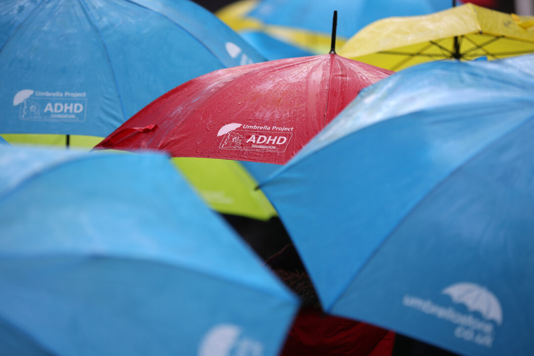 Children dance with their umbrellas at the launch of an art installation called the Umbrella Project, featuring 200 brightly coloured umbrellas suspended over Church Alley in Liverpool, England, on June 22, 2017. (Christopher Furlong/Getty Images)
